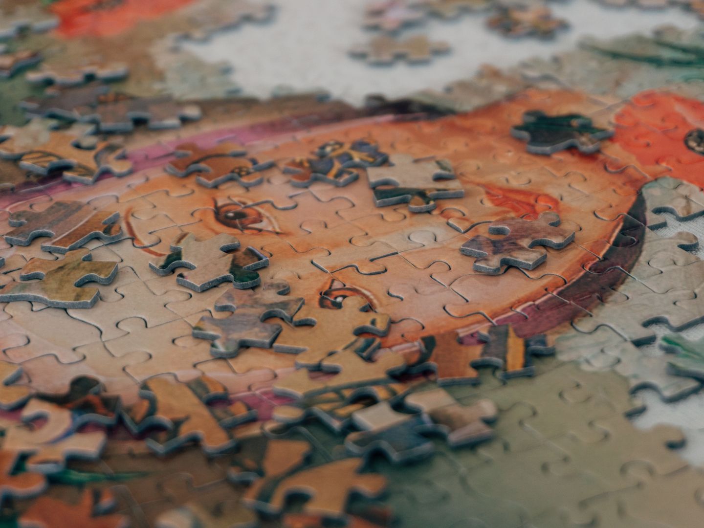 Detailed close up of colorful jigsaw puzzle pieces forming an eye catching pattern.